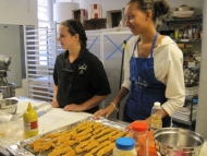 A tray full of chicken tenders and their excited makers